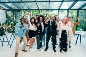 Elevate Your Corporate Events with Premier MC and DJ Services in OKC 4 happy corporate team celebrating after a successful event